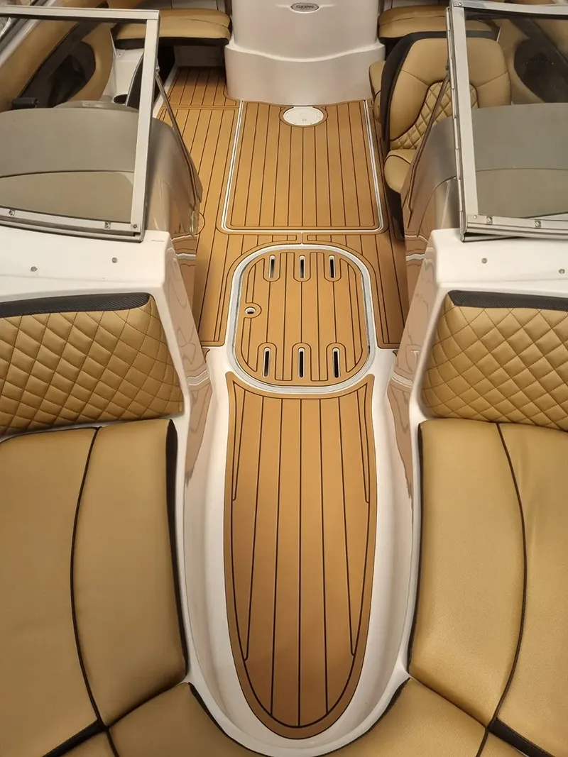 Finished custom boat flooring with teak-style marine deck mats installed