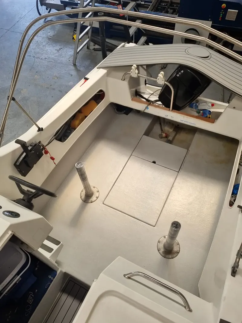 Boat deck before custom marine flooring installation in a workshop